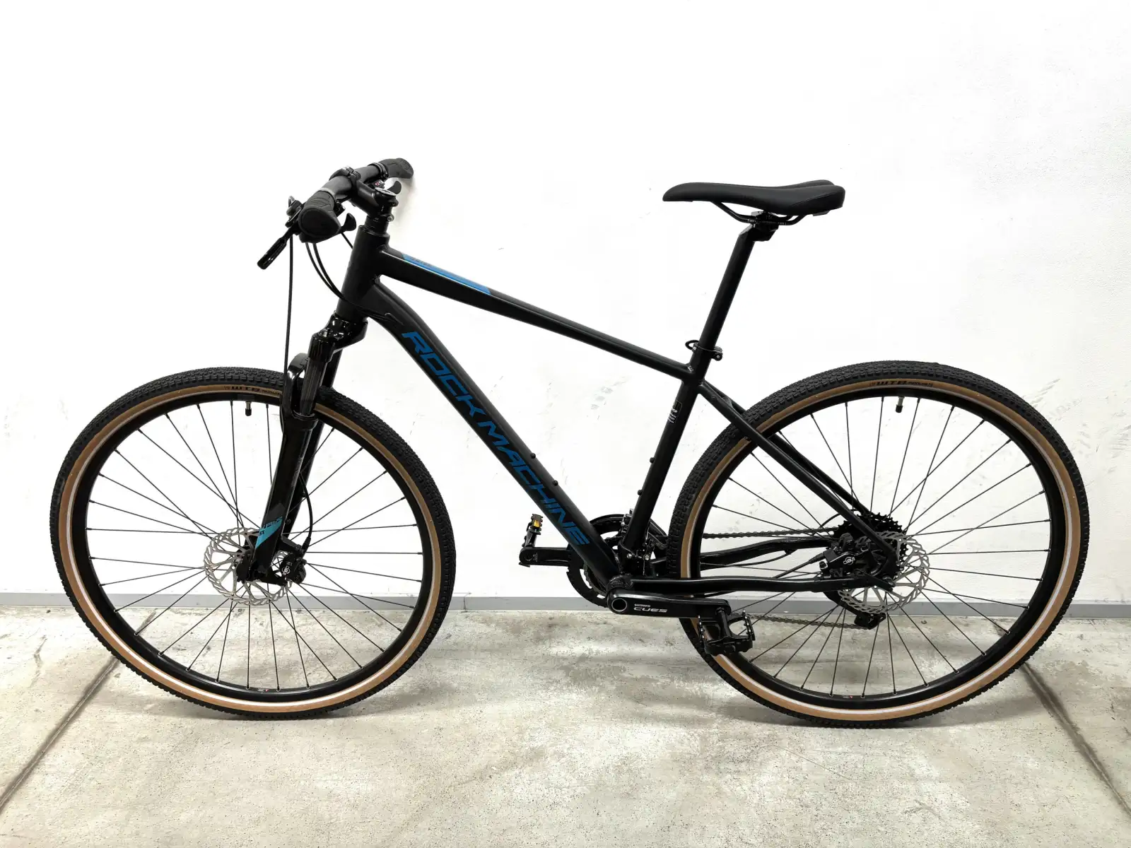 Rock Machine CrossRide 700 Trekkingrad black/petrol MUSTER