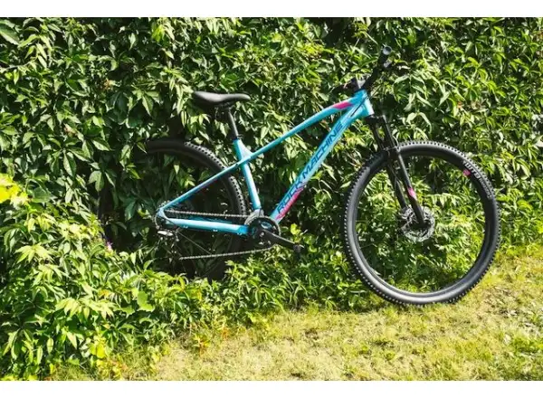Rock Machine Catherine 10-29 in Neon Cyan/Petrol/Pink mountain bike.